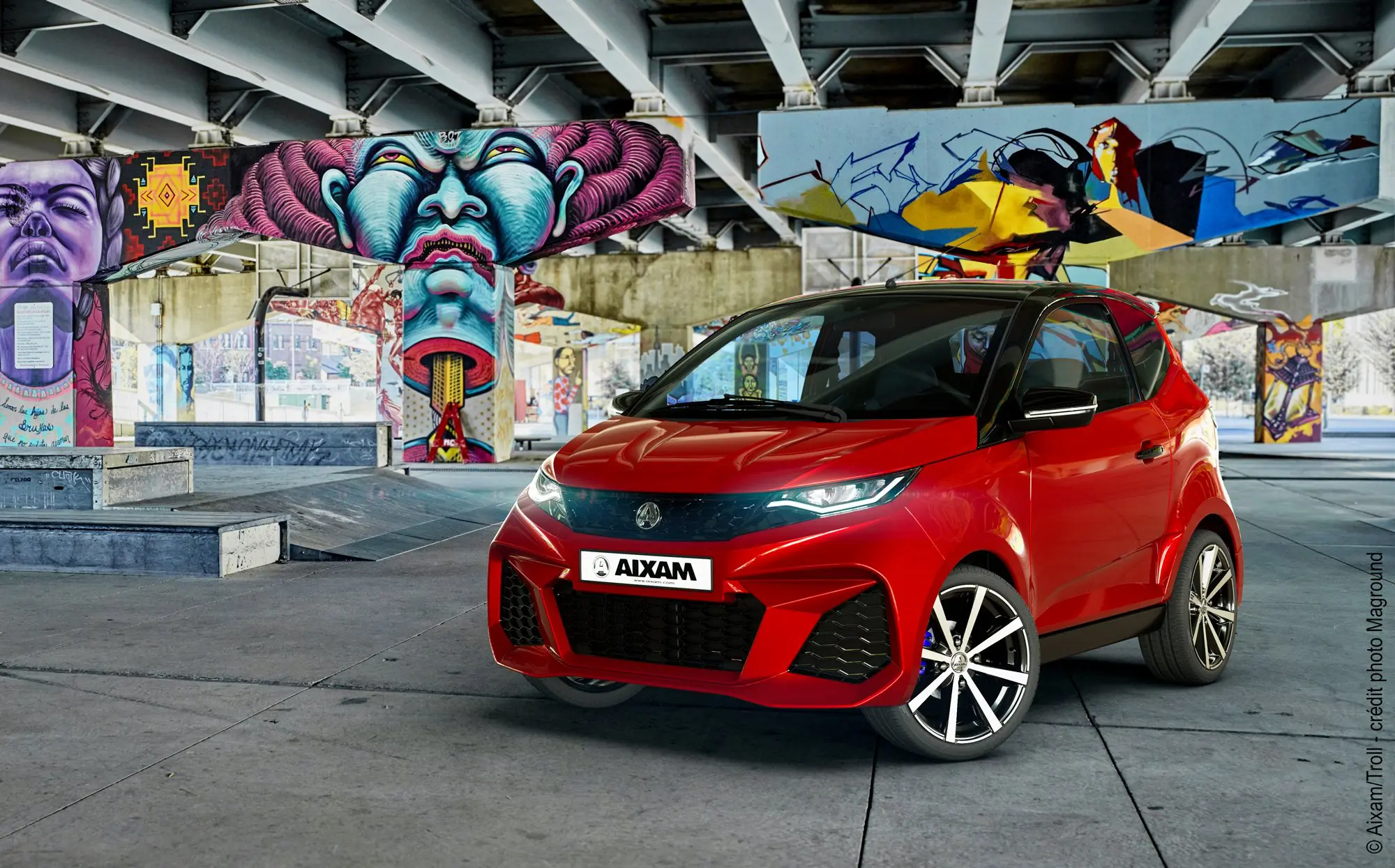 Visuel 3d photo-réaliste d'une Aixam City Gto rouge dans un environnement urbain coloré.